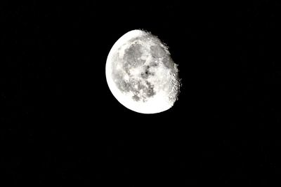 Low angle view of moon against sky at night