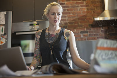 Portrait of woman using laptop