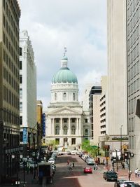 View of buildings against cloudy sky