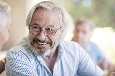 Portrait of smiling senior man wearing glasses