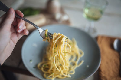 Personal perspective of pasta on fork