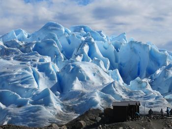 Scenic view of glacier against sky