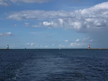 Sailboat sailing on sea against sky