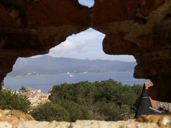 Scenic view of sea and rocks against sky