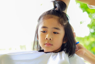 Portrait of cute girl looking up