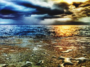 Scenic view of sea against sky at sunset