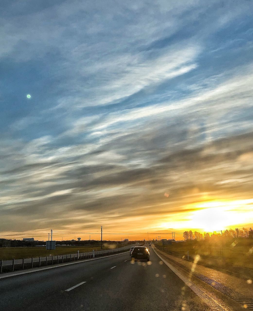 ROAD AGAINST SKY AT SUNSET