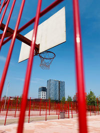 Low angle view of basketball hoop against blue sky