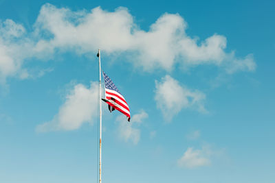 Low angle view of flag against sky