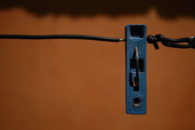 Close-up of clothespin hanging on clothesline