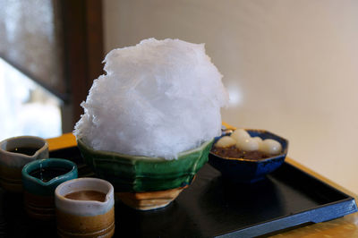 Close-up of fresh dessert served in glass plate on table