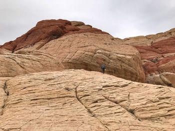 Low angle view of man on rock formation