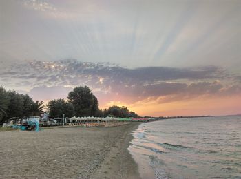 Scenic view of beach against sky during sunset