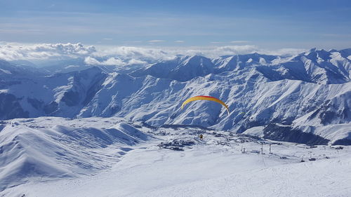 Scenic view of snowcapped mountains against sky