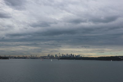 Scenic view of sea and buildings against sky