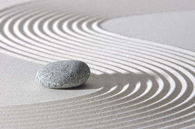 Japanese zen garden with stone in textured sand