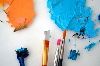 High angle view of paintbrushes on table