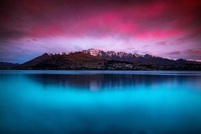 Scenic view of lake against sky during sunset