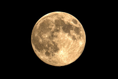 Low angle view of moon against sky at night