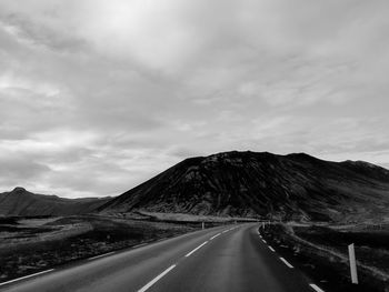 High angle view of road amidst mountains against sky