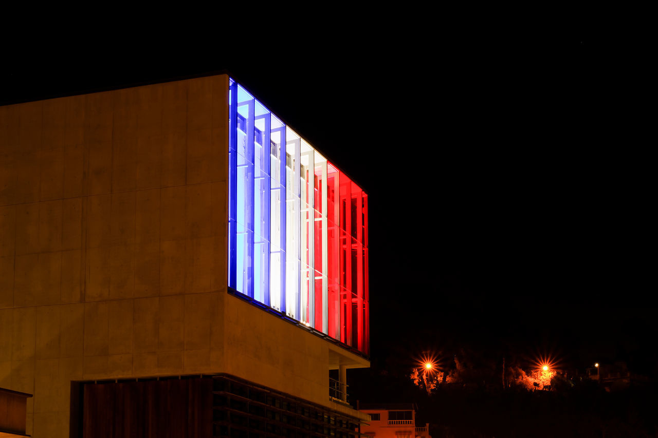 architecture, built structure, building exterior, illuminated, night, low angle view, clear sky, window, copy space, building, city, dark, no people, residential structure, residential building, house, outdoors, facade, multi colored, exterior