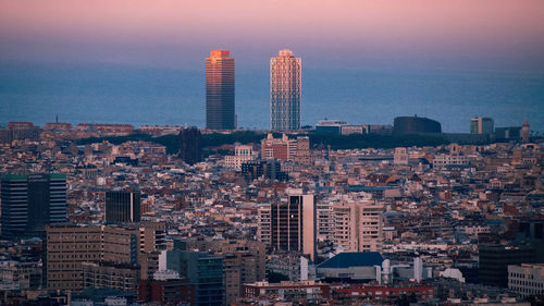 Modern buildings in city against sky