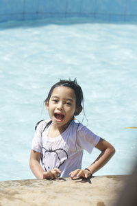 Portrait of cute girl in swimming pool