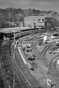 High angle view of railroad tracks in city against sky