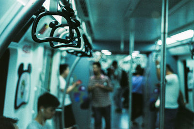 Side view of people traveling in train