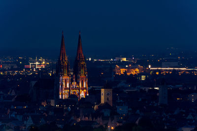 Illuminated buildings in city at night