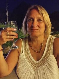 Close-up of young woman holding drink