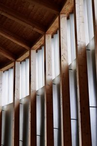 Close-up view of horizontal long windows and wood columns