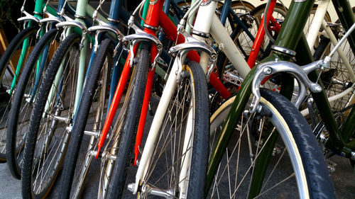 Close-up of bicycles parked in row