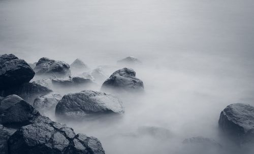 Scenic view of rocks against sky during winter