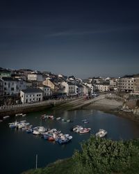 High angle view of harbour and buildings in city