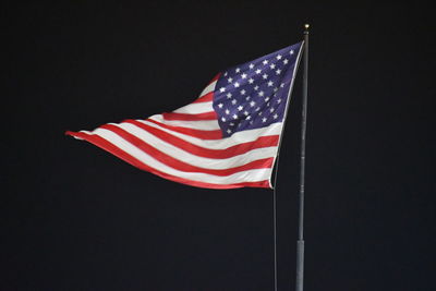 Low angle view of flag against the sky