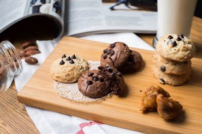 Close-up of cookies on cutting board over table