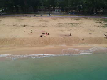 People on beach by sea