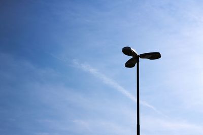 Low angle view of street light against sky