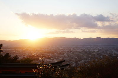 Silhouette of city during sunset