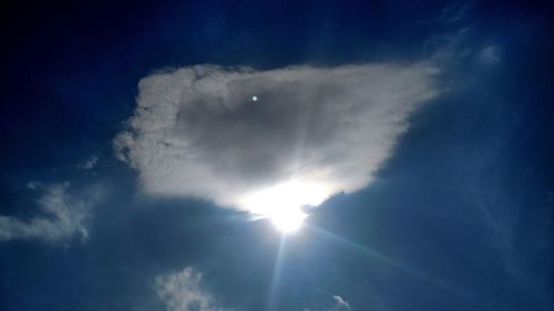 Sun shining through clouds