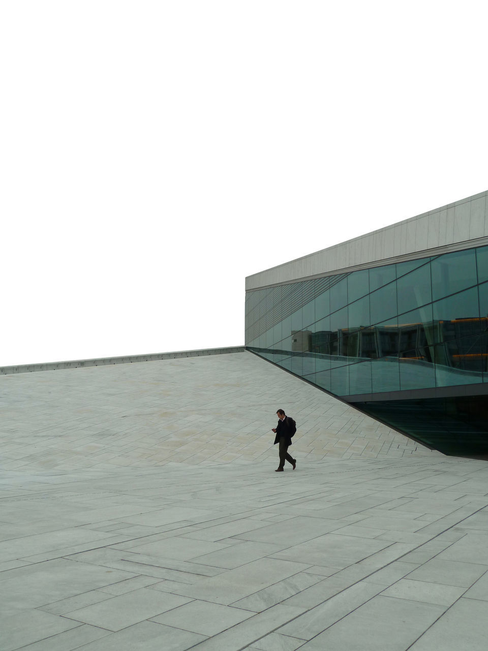 copy space, clear sky, winter, snow, architecture, built structure, full length, lifestyles, cold temperature, leisure activity, men, building exterior, walking, rear view, season, unrecognizable person, standing, person