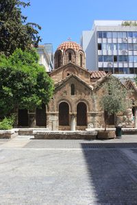 Facade of temple against building