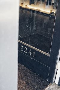 High angle view of text on glass window