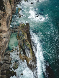 High angle view of rocks in sea