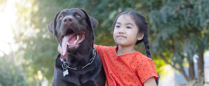 Portrait of girl with dog