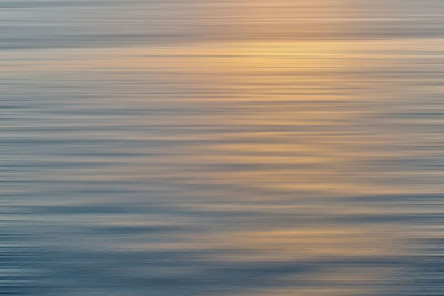 Scenic view of sea against sky at sunset