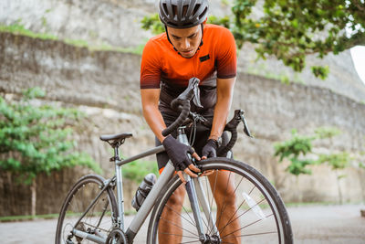 Man riding bicycle on street