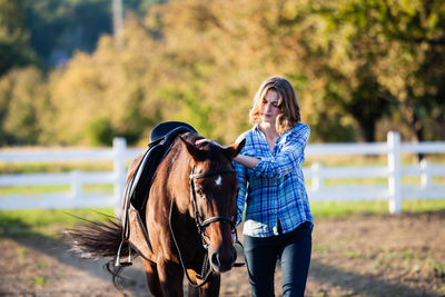 Man riding horse on field