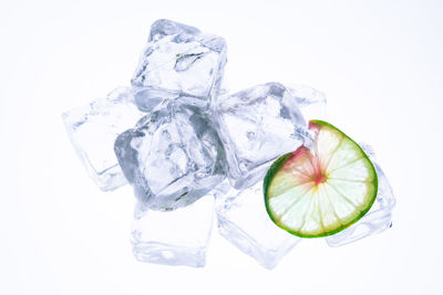 Close-up view of fruit over white background